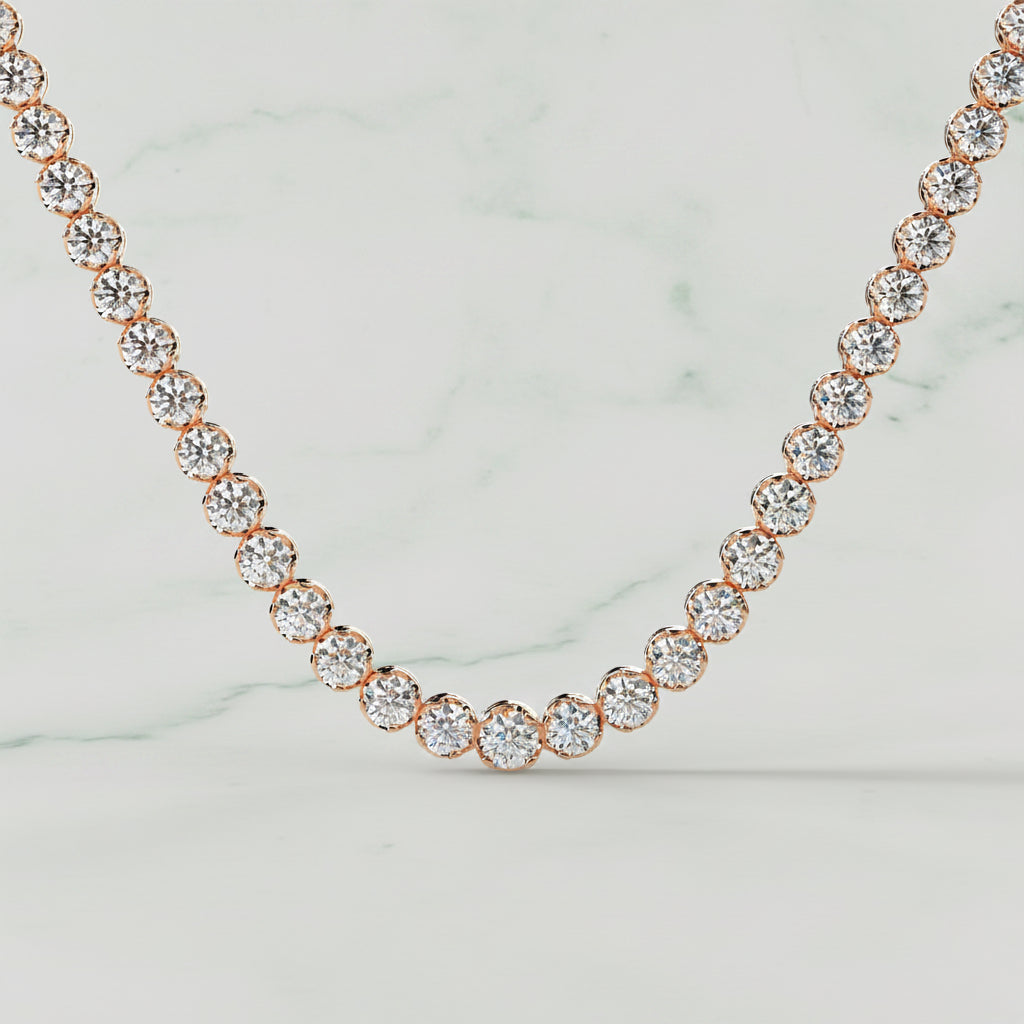 Rose gold necklace with clear stones on a beige background