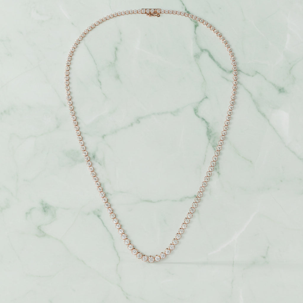 Silver necklace on a light beige background