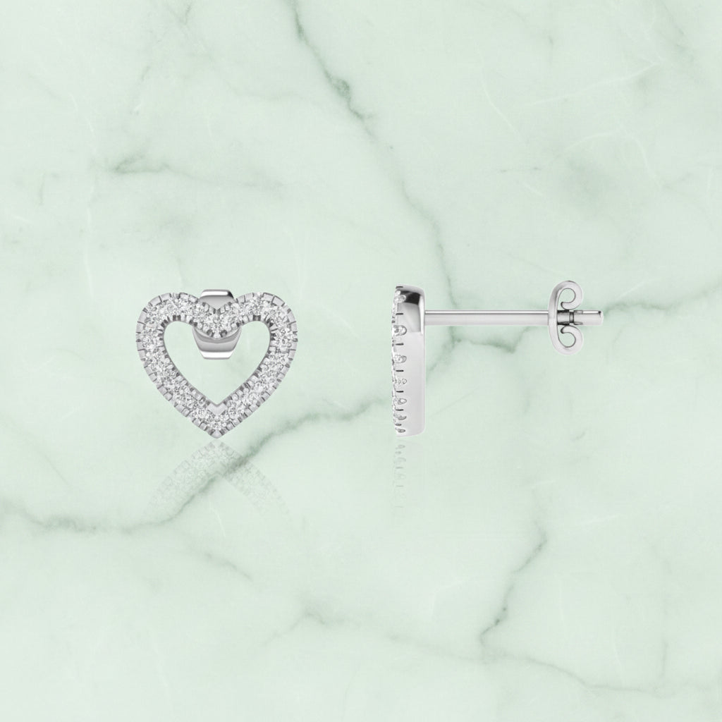 Heart-shaped earrings with clear stones on a white background