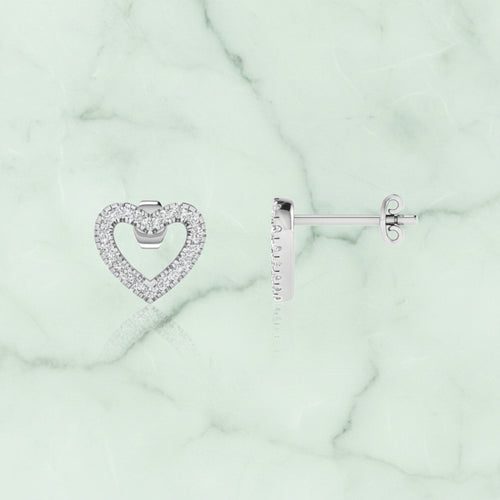 Heart-shaped earrings with clear stones on a white background