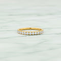 Gold ring with diamonds on a white background