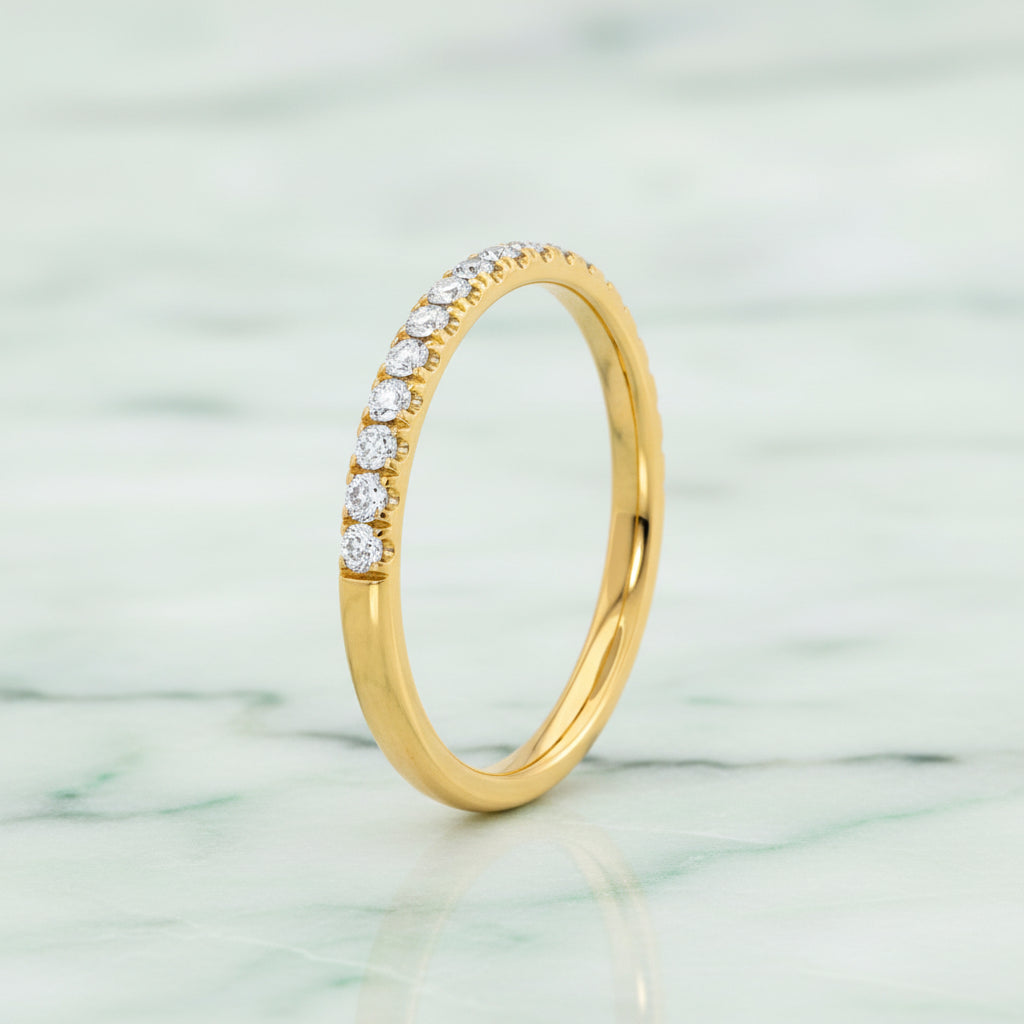 Gold ring with diamonds on a white background