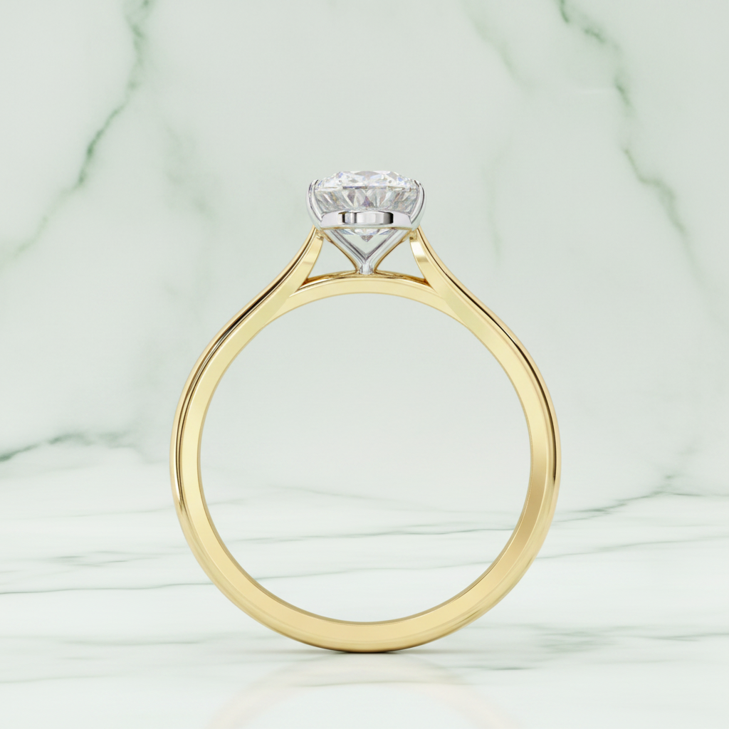 Gold ring with a diamond on a white background